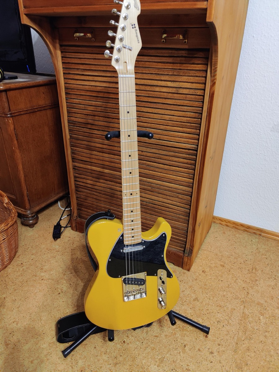An electric guitar on the bench